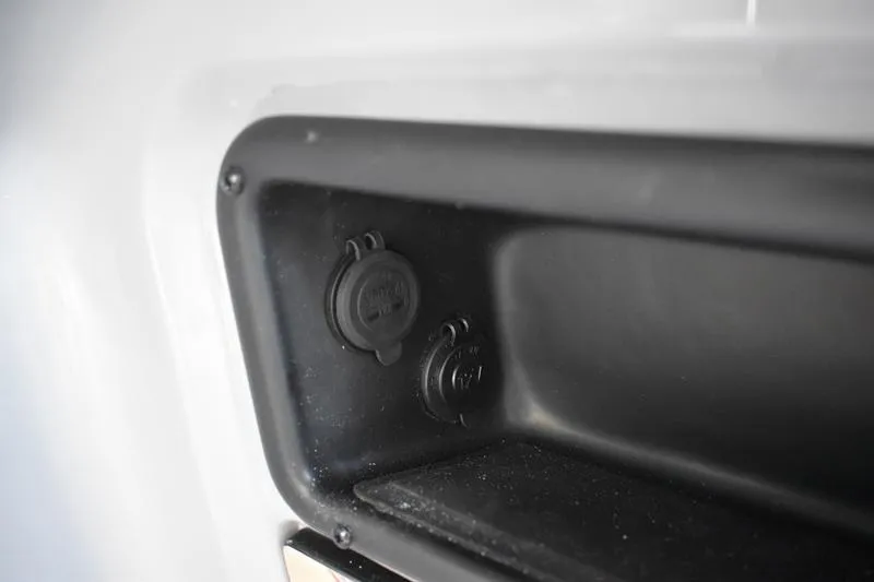 Slide: The Image of Control panel of 2026 Lowe LS 170 boat with capacity label and ignition switch. - 27