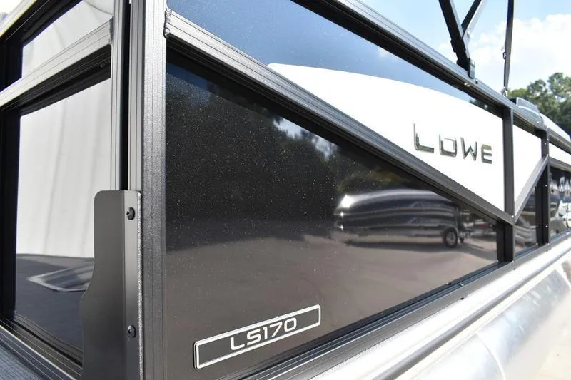 Slide: The Image of 2026 Lowe LS 170 boat side view with sleek black finish and logo. - 3
