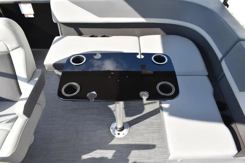 Slide: The Image of 2026 Lowe LS 170 boat interior with sleek seating and modern table design. - 34