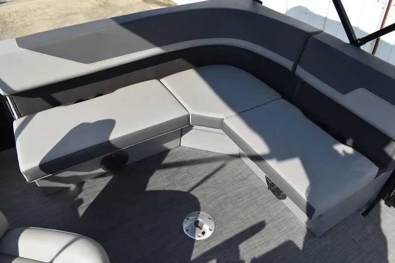 Slide: The Image of Interior of 2026 Lowe LS 170 boat showing storage compartment and cup holders. - 37