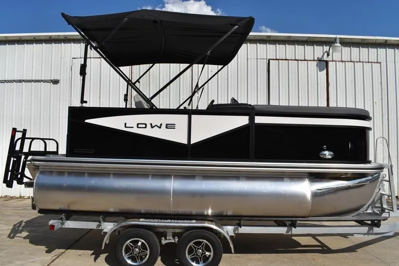 Slide: The Image of Close-up of 2026 Lowe LS 170 boat's sleek chrome LED light and sensor. - 42