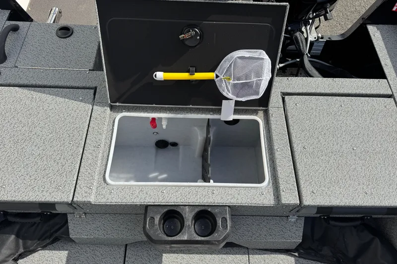 Slide: The Image of 2026 Lund 2075 Impact XS boat livewell with net and storage compartments. - 13