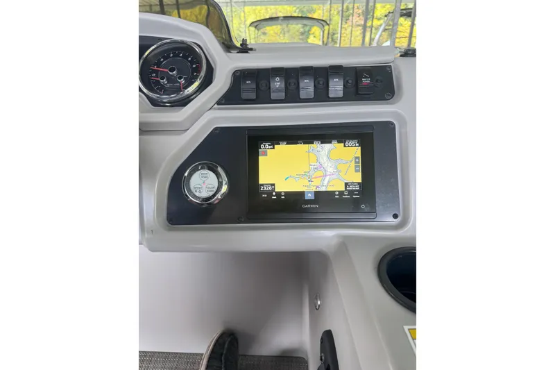 Slide: The Image of Dashboard of 2024 Godfrey SWEETWATER 2486 DT with Garmin navigation display. - 6