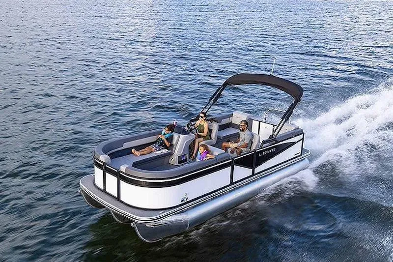 Slide: The Image of 2026 Lowe LS 210 WT pontoon boat on trailer, black and silver design. - 1