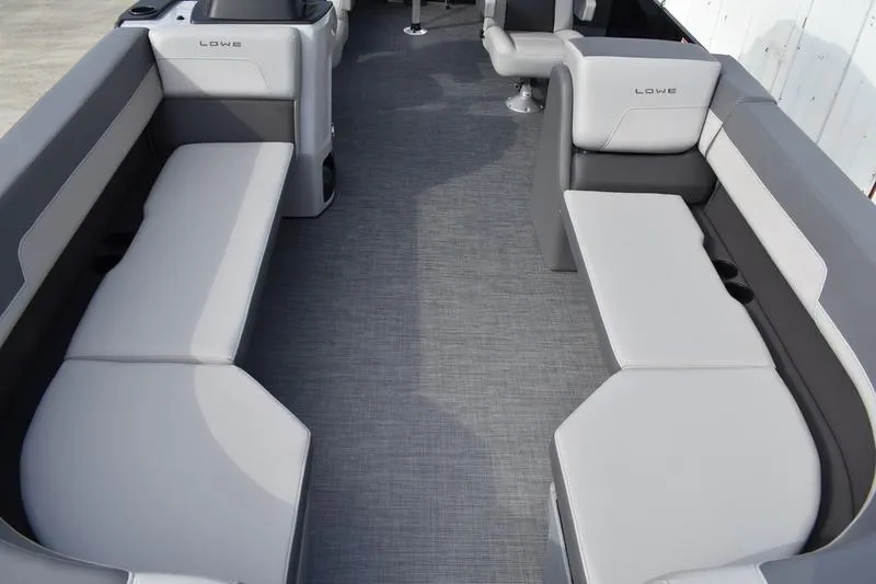 Slide: The Image of 2026 Lowe LS 210 WT boat interior with gray cushioned seating. - 13