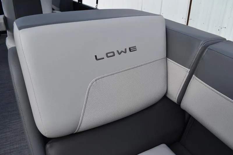 Slide: The Image of Open storage compartment in 2026 Lowe LS 210 WT boat seat. - 17