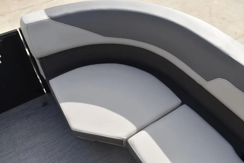 Slide: The Image of 2026 Lowe LS 210 WT boat seating with gray upholstery and integrated cup holders. - 18