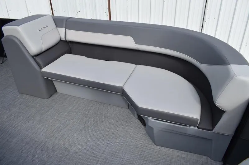 Slide: The Image of Interior of 2026 Lowe LS 210 WT boat with gray seating and steering wheel. - 22