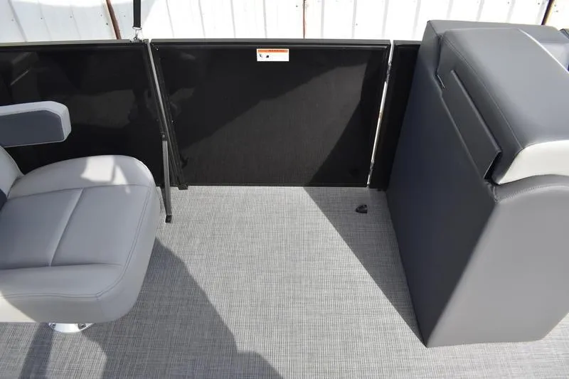 Slide: The Image of 2026 Lowe LS 210 WT boat interior with steering console and captain's chair. - 27