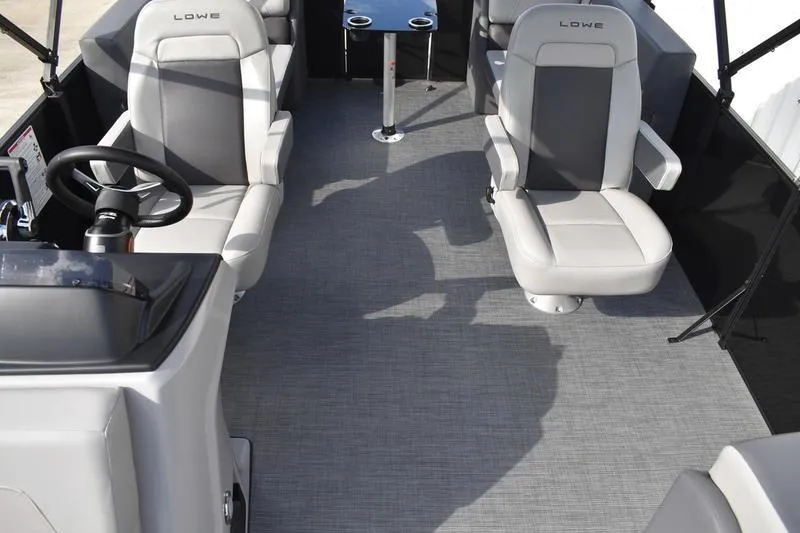 Slide: The Image of 2026 Lowe LS 210 WT boat interior with steering wheel and control panel. - 29
