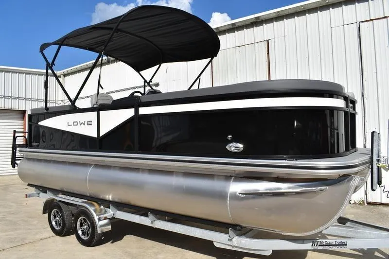 Slide: The Image of 2026 Lowe LS 210 WT pontoon boat rear view with ladder and aluminum pontoons. - 3