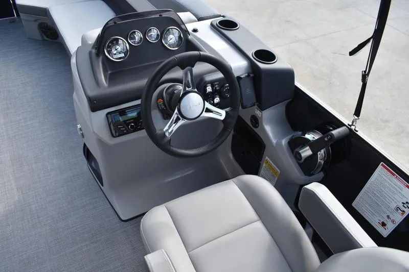 Slide: The Image of 2026 Lowe LS 210 WT boat dashboard with steering wheel and gauges. - 31