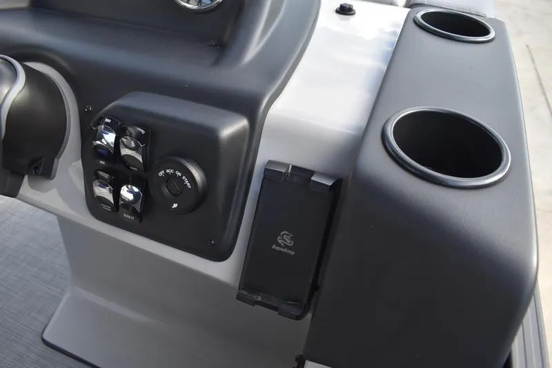 Slide: The Image of 2026 Lowe LS 210 WT boat interior with seating and table featuring cup holders. - 36