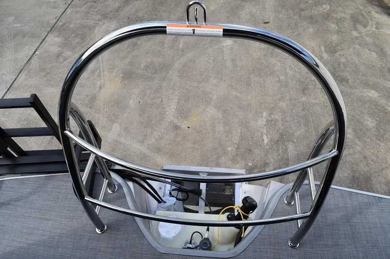 Slide: The Image of 2026 Lowe LS 210 WT pontoon boat rear view with ladder and trailer. - 4