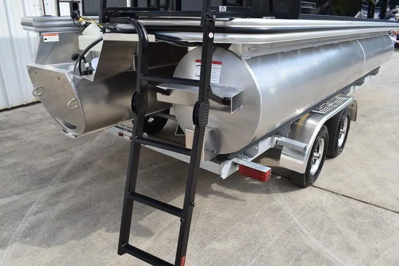 Slide: The Image of 2026 Lowe LS 210 WT pontoon boat on trailer, sleek black and silver design. - 7