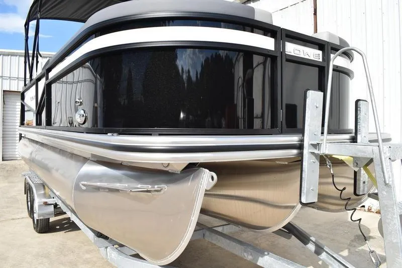 Slide: The Image of 2026 Lowe LS 210 WT boat interior with gray seating and carpeted floor. - 8