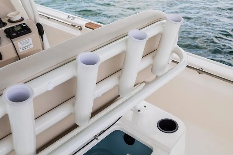 Slide: The Image of Manufacturer Provided Image: 2026 Boston Whaler 210 Montauk boat with rod holders and seating, on water. - 12