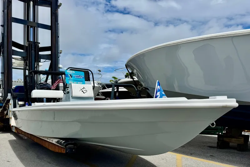 The Image of 2026 Piranha B2000 boat displayed outdoors on a forklift under a cloudy sky. - 0