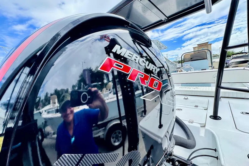 Slide: The Image of Mercury Pro outboard engine on Piranha B2000 boat, 2026 model, reflecting surroundings. - 7