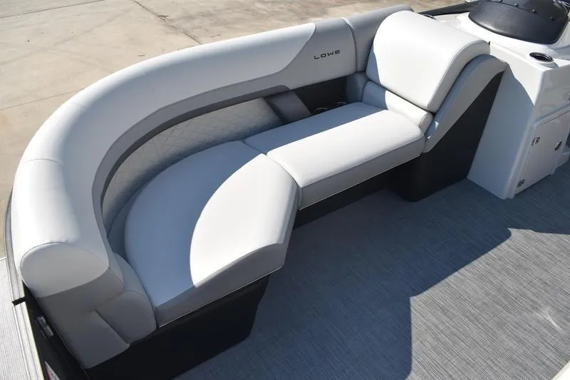 Slide: The Image of 2026 Lowe SS 230 pontoon boat with spacious seating and modern design. - 11