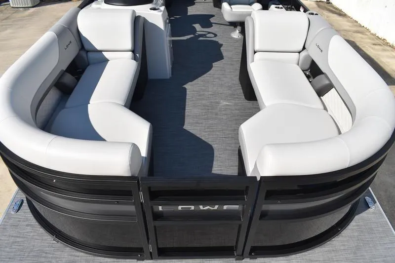 Slide: The Image of 2026 Lowe SS 230 boat interior with sleek, curved seating and modern design. - 12