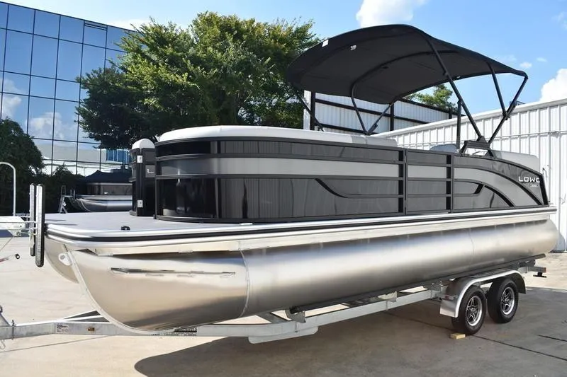 Slide: The Image of 2026 Lowe SS 230 boat interior with sleek gray seating and modern design. - 13