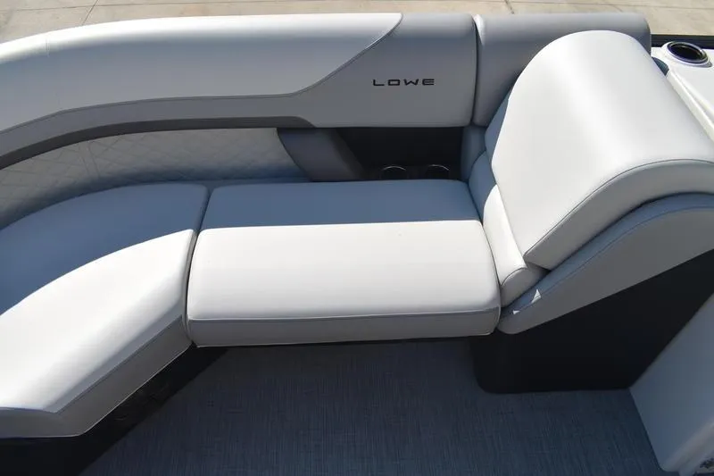 Slide: The Image of 2026 Lowe SS 230 boat interior with sleek, modern seating and cup holders. - 15