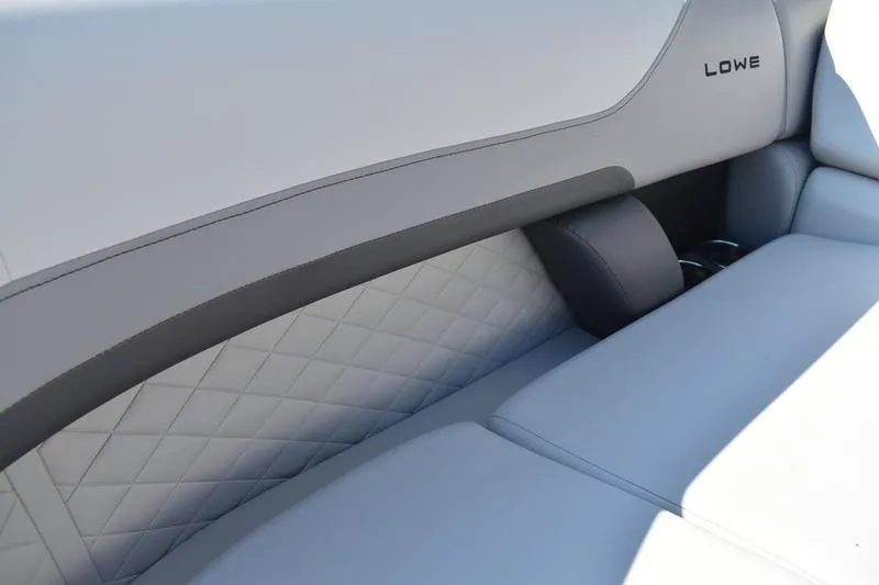 Slide: The Image of Interior of 2026 Lowe SS 230 boat with storage compartment and cup holders. - 17