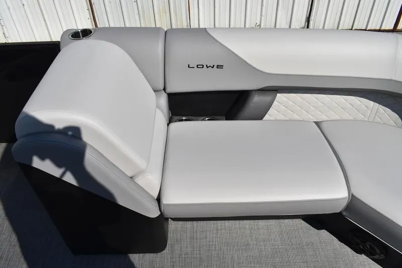 Slide: The Image of 2026 Lowe SS 230 boat interior with sleek gray seating and cup holder. - 20