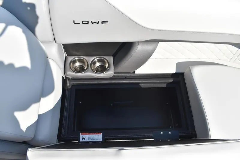 Slide: The Image of 2026 Lowe SS 230 boat seat storage compartment with cup holder. - 21