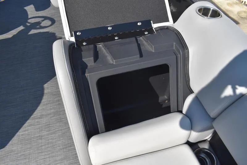Slide: The Image of 2026 Lowe SS 230 boat interior storage compartment with cushioned seating and quilted design. - 22
