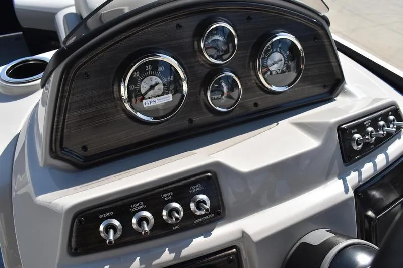 Slide: The Image of Control panel of a 2026 Lowe SS 230 boat with switches and buttons. - 33