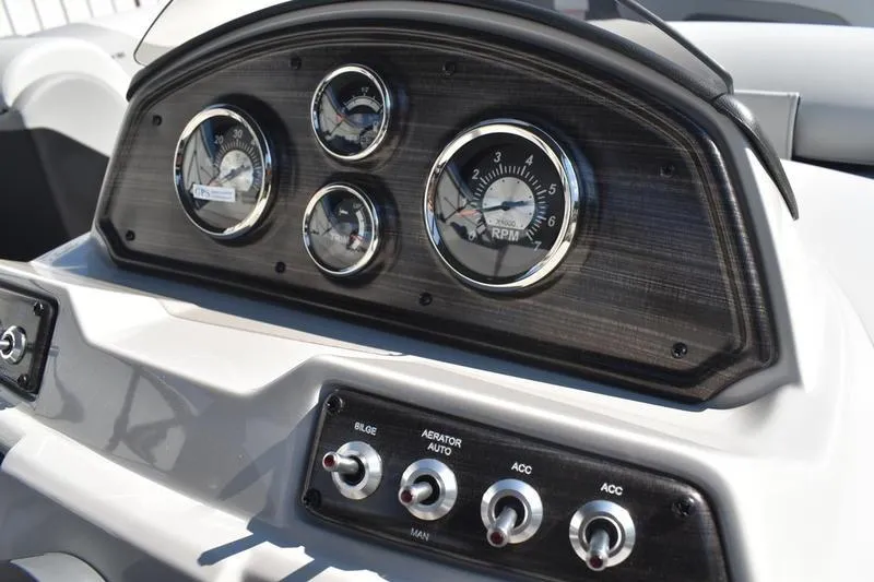 Slide: The Image of Close-up of a 2026 Lowe SS 230 boat steering mechanism with warning label. - 35