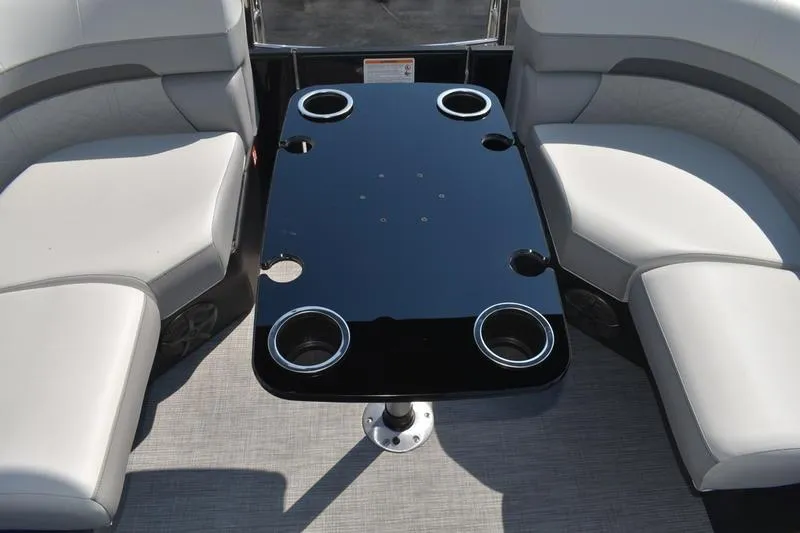 Slide: The Image of 2026 Lowe SS 230 boat interior with sleek table and cup holders. - 37