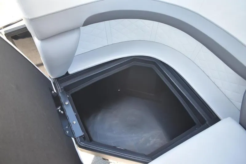 Slide: The Image of Interior storage compartment with cup holder in 2026 Lowe SS 230 boat. - 42