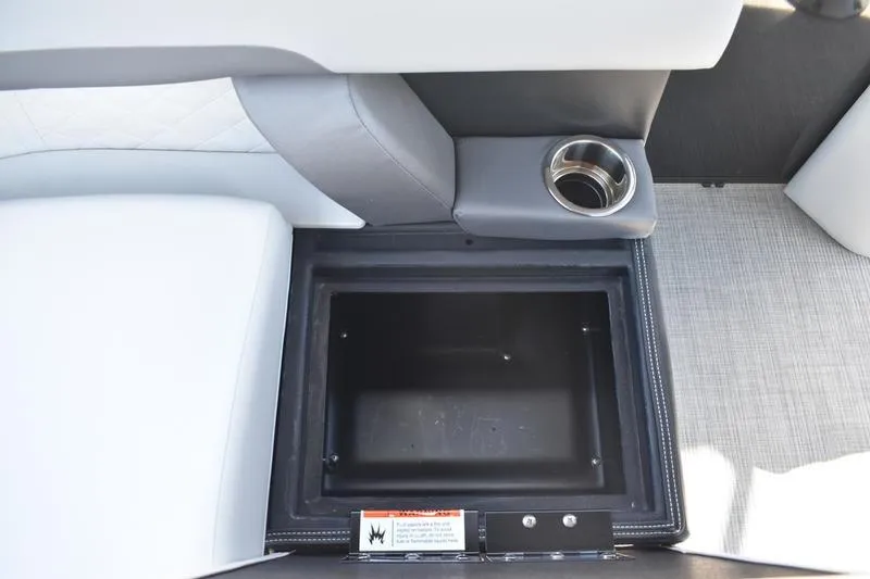 Slide: The Image of 2026 Lowe SS 230 boat interior with gray cushioned seating and cup holders. - 43