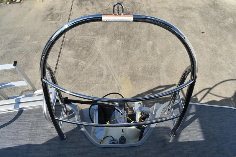 Slide: The Image of 2026 Lowe SS 230 boat with stainless steel railing and engine compartment. - 49