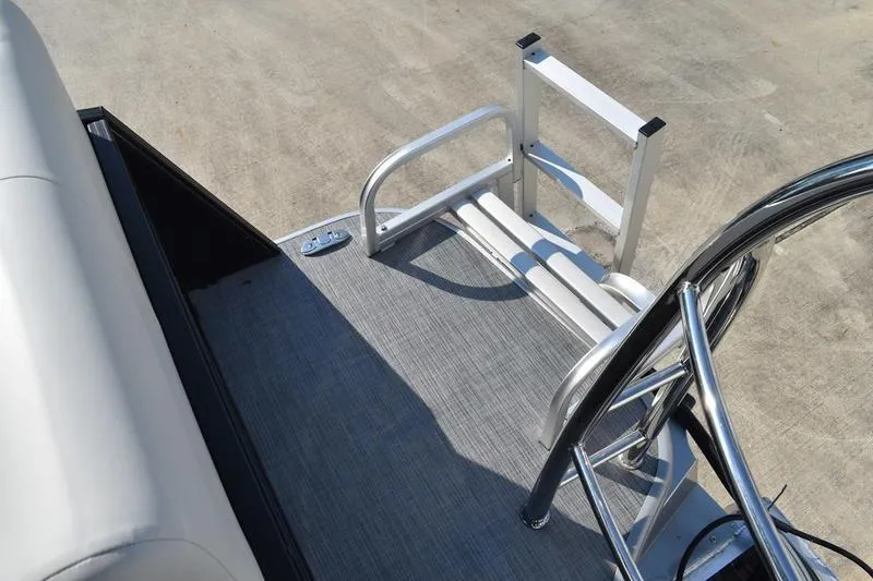 Slide: The Image of 2026 Lowe SS 230 boat interior with cushioned seating and built-in speaker. - 51