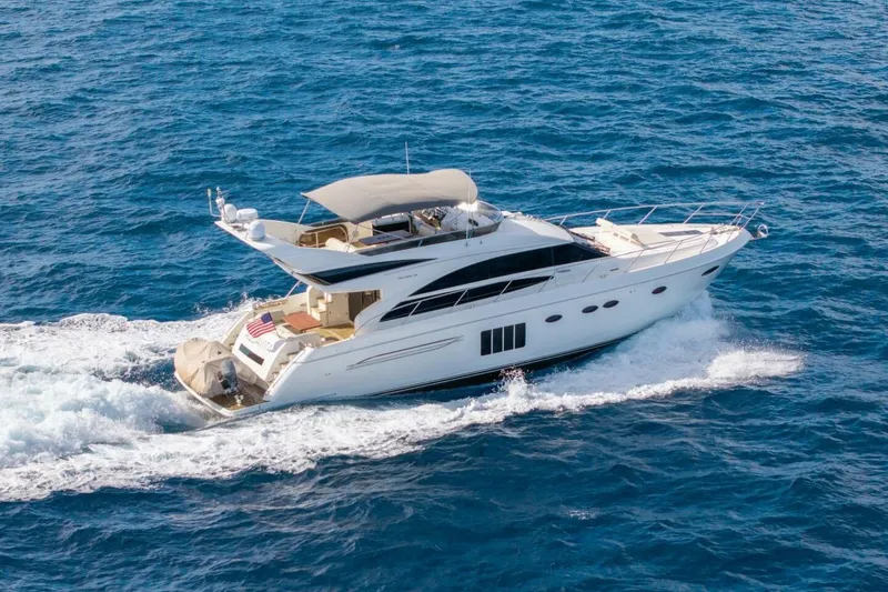 The Image of 2012 Princess 64 Flybridge Motor Yacht cruising on open blue sea. - 0