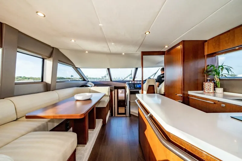Slide: The Image of Luxurious 2012 Princess 64 Flybridge Motor Yacht with elegant outdoor seating and dining area. - 15