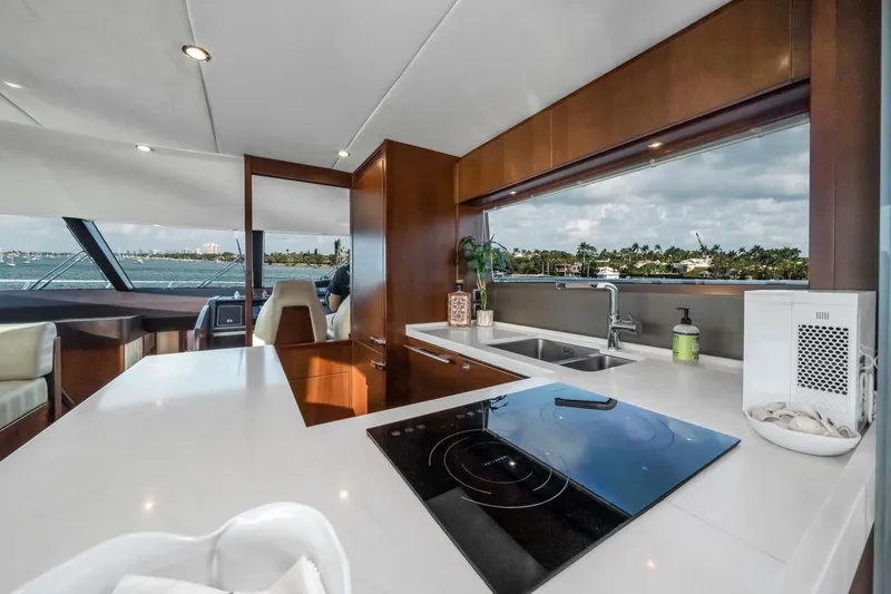 Slide: The Image of Engine room of a 2012 Princess 64 Flybridge Motor Yacht, showcasing detailed machinery. - 18