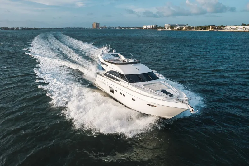 Slide: The Image of 2012 Princess 64 Flybridge Motor Yacht cruising on open sea. - 2