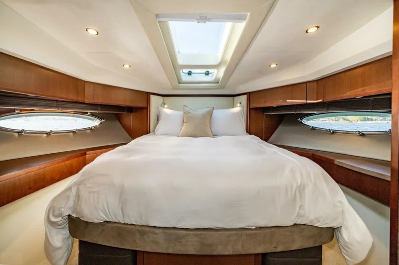 Slide: The Image of Luxurious interior of 2012 Princess 64 Flybridge Motor Yacht with modern kitchen and seating area. - 27