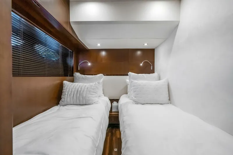 Slide: The Image of Interior staircase of 2012 Princess 64 Flybridge Motor Yacht, featuring elegant wood paneling. - 32