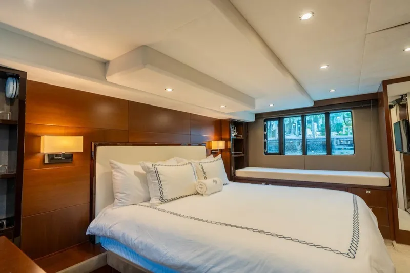 Slide: The Image of Luxurious bedroom interior of 2012 Princess 64 Flybridge Motor Yacht with elegant wood paneling. - 37