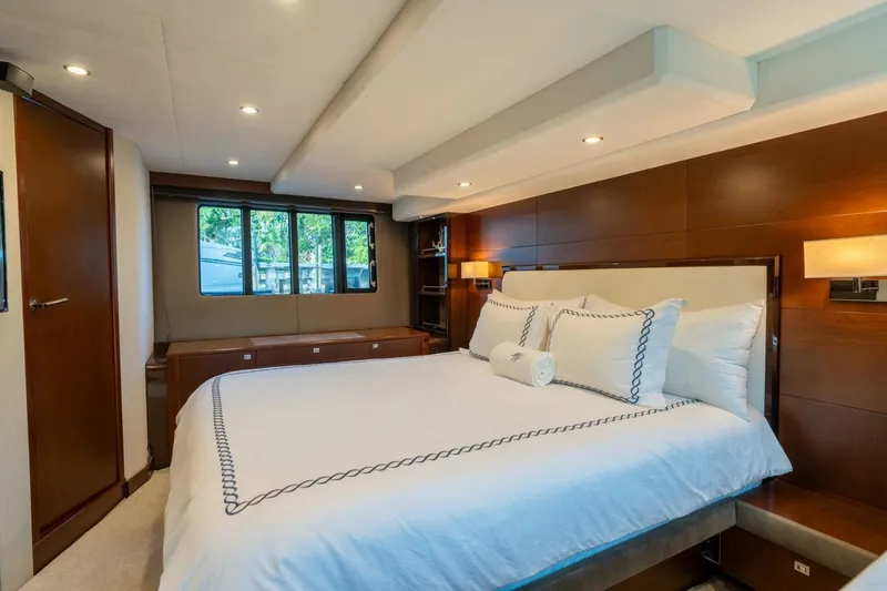 Slide: The Image of Luxurious bedroom interior of 2012 Princess 64 Flybridge Motor Yacht with elegant wood paneling. - 38