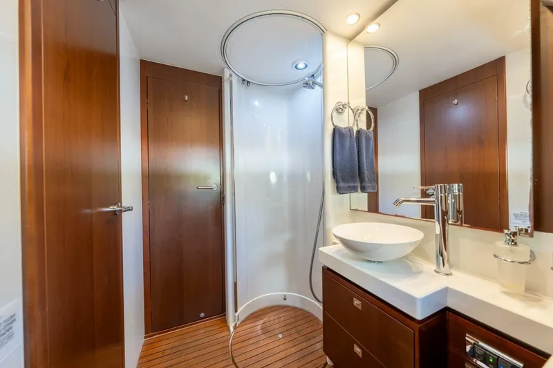 Slide: The Image of Luxurious bathroom on 2012 Princess 64 Flybridge Motor Yacht with modern fixtures and wood accents. - 39