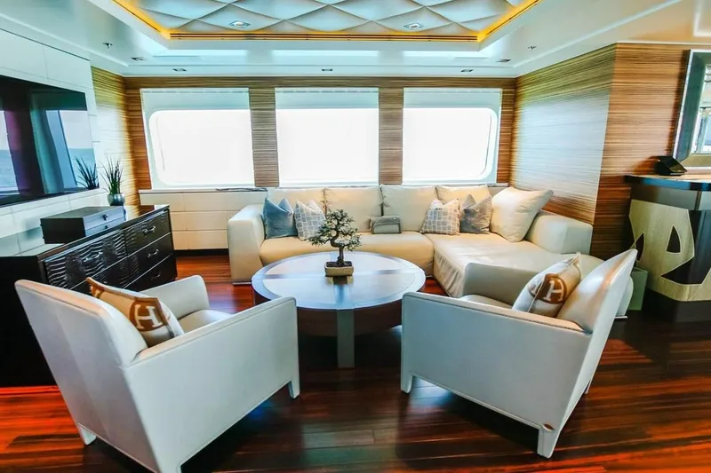 Slide: The Image of Luxurious deck of 2013 Feadship motor yacht with chairs, overlooking serene waterfront view. - 18