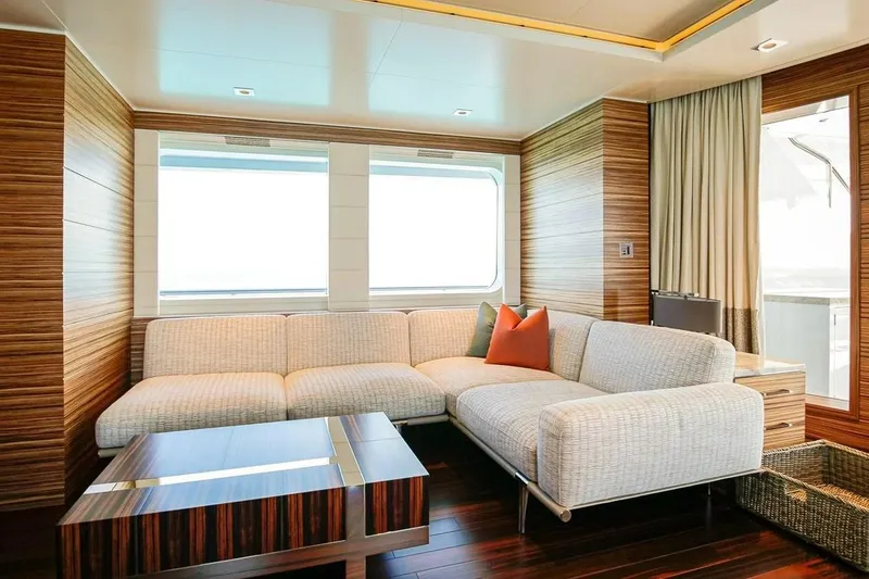 Slide: The Image of Luxurious Feadship motor yacht interior with modern seating, wood flooring, and ocean view windows. - 3