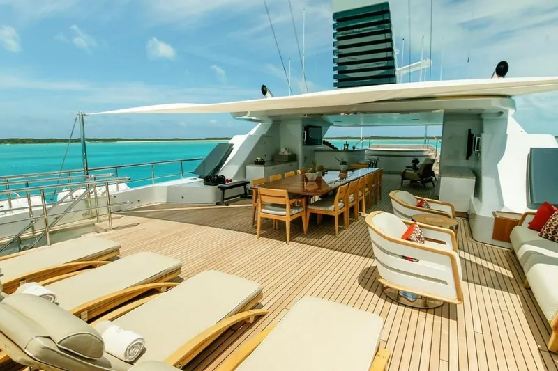 Slide: The Image of Luxurious 2013 Feadship motor yacht bedroom with ensuite bathroom, featuring elegant wood paneling. - 30